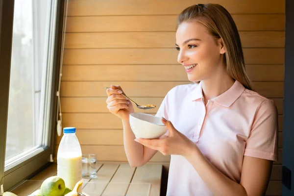 Happy Woman Holding Spoon Cornflakes Bottle Milk Fruits — Stock Photo, Image