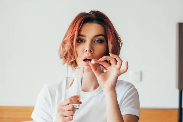 Attractive Girl Eating Pill Holding Glass Water Home Self Isolation — Stock Photo, Image