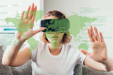 emotional girl gesturing and using virtual reality headset with signs at home on quarantine with world map clipart