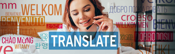 beautiful happy girl making video call with headset and laptop in bed during self isolation with translate lettering 