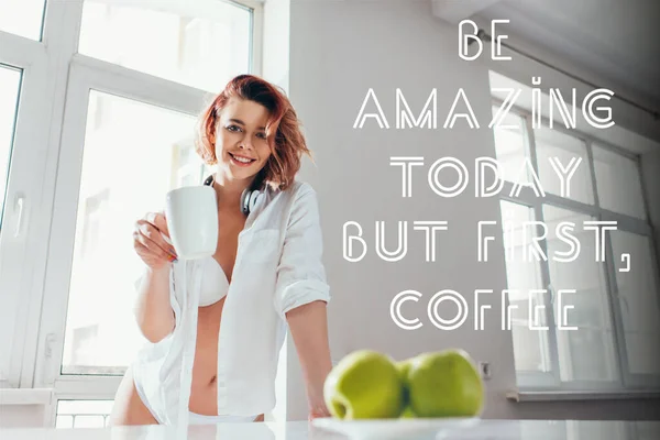 beautiful happy girl having coffee for breakfast during self isolation with be amazing today but first, coffee lettering