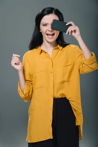 Brunette woman using smartphone — Stock Photo