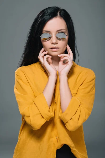 Brunette woman in yellow blouse — Stock Photo