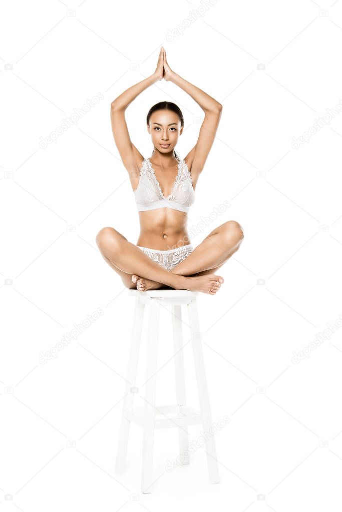 african american woman sitting in lotus position
