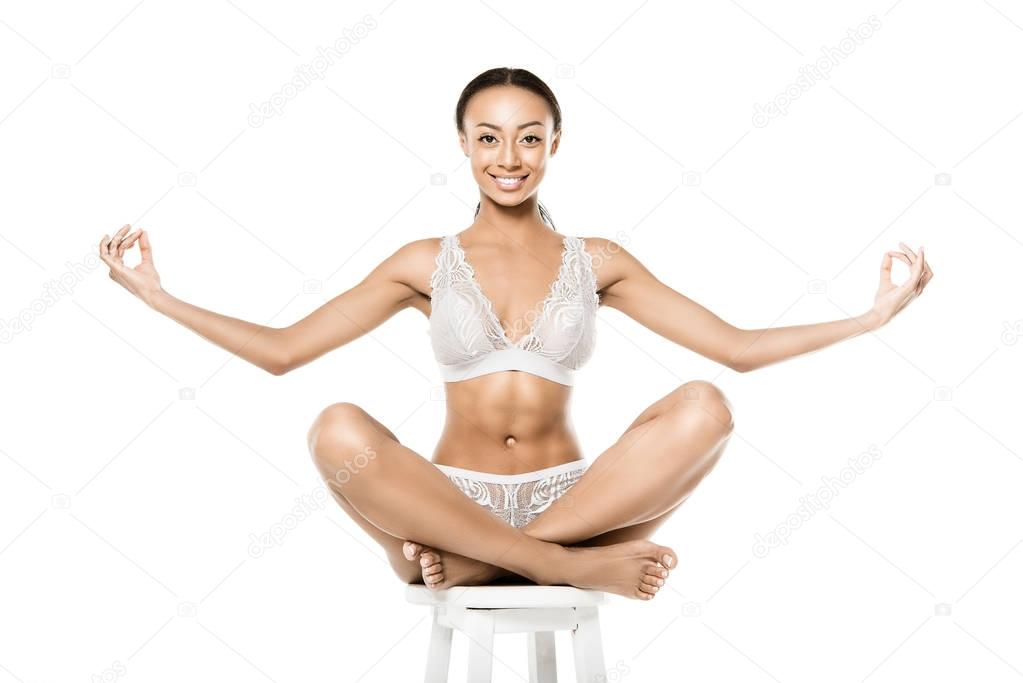 african american woman sitting in lotus position