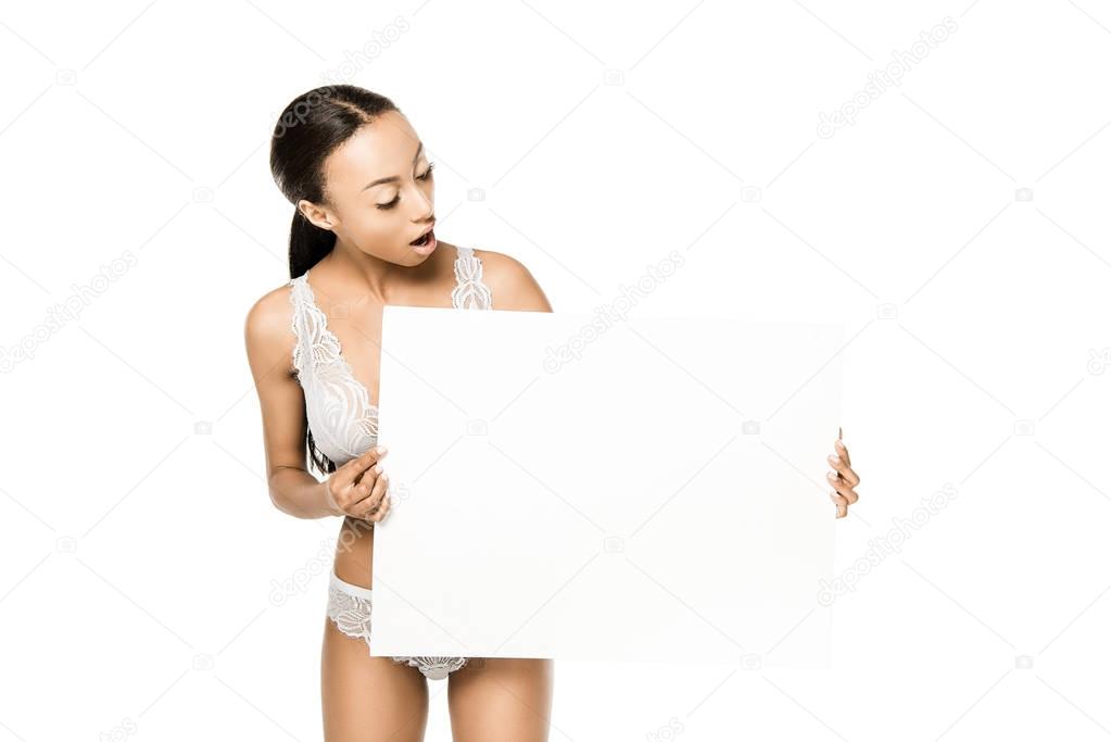 shocked african american woman with banner