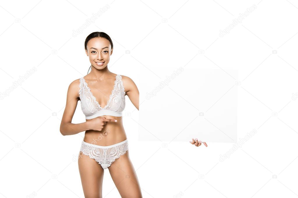 african american woman pointing at banner