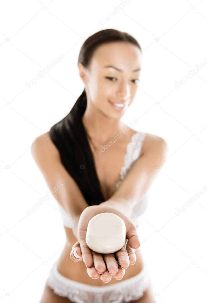 african american woman holding soap
