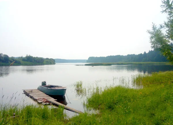 View on lake with a boat fog day — Stock Photo, Image