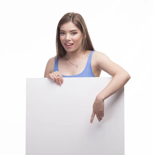 Young happy woman showing presentation, pointing on placard over — Stock Photo, Image