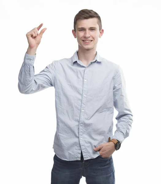 Junger glücklicher Mann zeigt sich an den Händen — Stockfoto