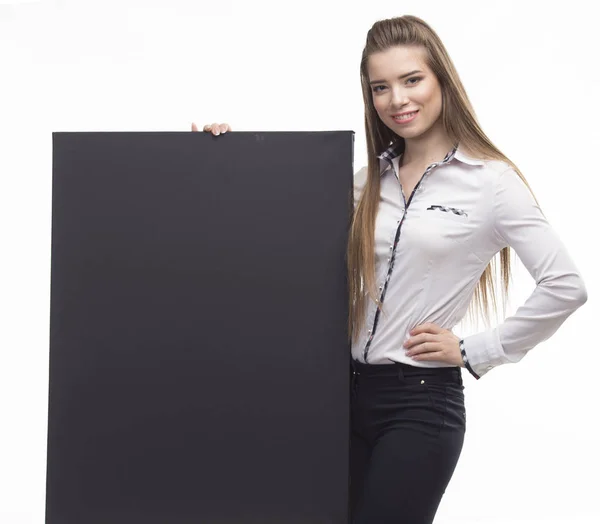 Giovane donna felice mostra presentazione, che punta sul cartello sopra — Foto Stock