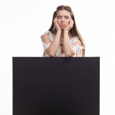 Young jocose woman showing presentation, pointing on placard clipart