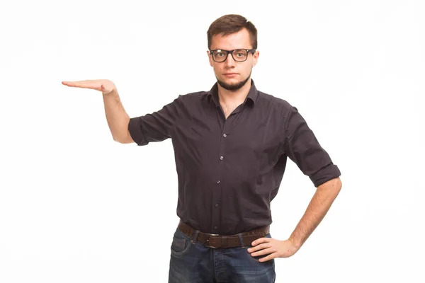 Young serious man showing presentation, pointing on placard — Stock Photo, Image