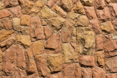 Sıcak renklerde taş duvar dokusu