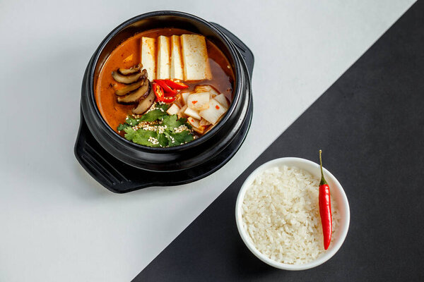 korean dish spicy soup with beef and vegetables with rice and hot pepper