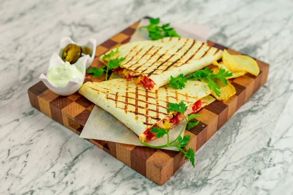 quesadillas with vegetables and jalapenos with sauce