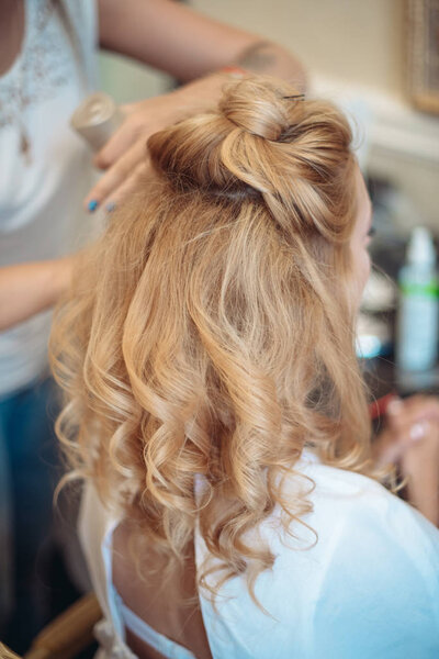 Hairstyle of the bride. Beautiful wedding hairstyle for the bride. Large with details