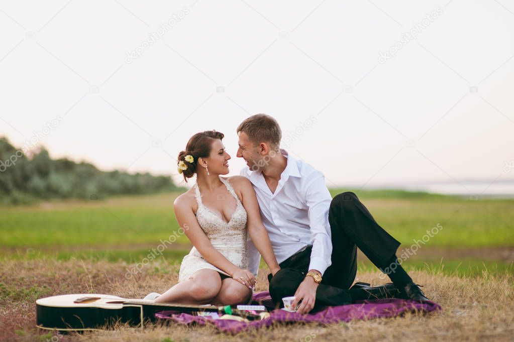 Couple in love in a mountainous area at a picnic