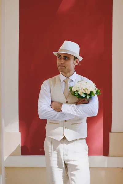 Portrait of the groom on a wedding day walk