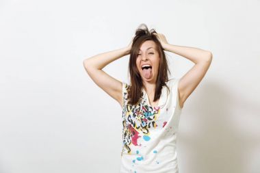 Beautiful European young funny and cheerful brown-haired woman with healthy clean skin, dressed in casual light clothes is fooling around at camera, on a white background. Emotions concept. clipart