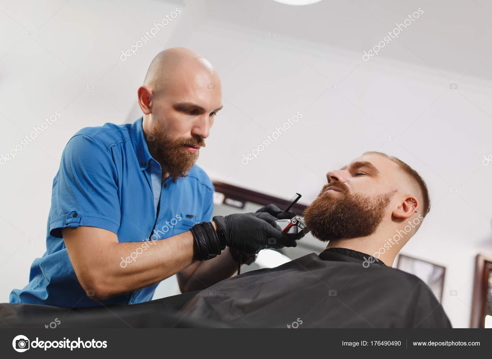 Male Professional Hairdresser Serving Client By Clipper Ginger