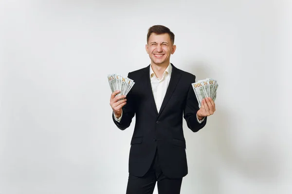 Jonge succesvolle knappe rijke zakenman in zwart pak holdin — Stockfoto