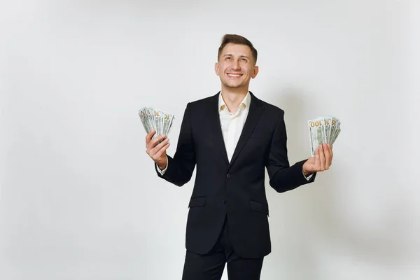 Jonge succesvolle knappe rijke zakenman in zwart pak holdin — Stockfoto