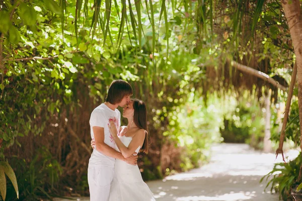 Wedding couple on an island in palms — Stock Photo, Image