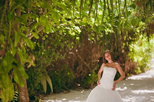 Beautiful bride on an island in palms — Stock Photo, Image