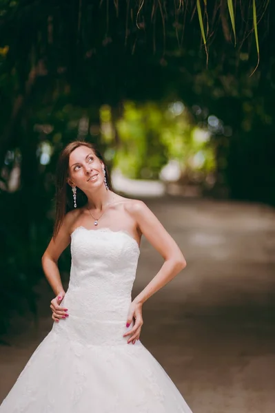 Beautiful bride on an island in palms — Stock Photo, Image