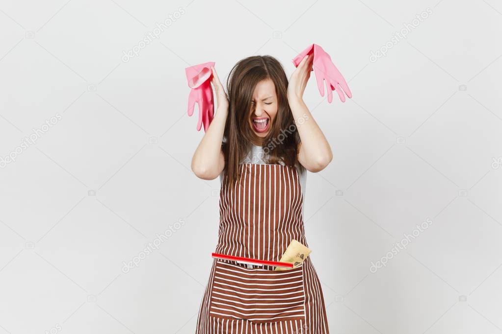 Young fun crazy dizzy loony wild screaming housewife tousled hair in striped apron squeegee cleaning rag in pocket isolated on white background. Mad woman and pink gloves. Copy space for advertisement