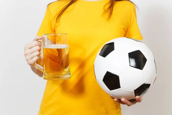 Close up cropped European young woman, football fan or player in yellow uniform holding pint mug of beer, soccer ball isolated on white background. Sport, play football, healthy lifestyle concept. — Stock Photo, Image