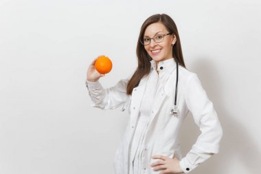 Smiling experienced beautiful young doctor woman with stethoscope, glasses isolated on white background. Female doctor in medical gown holding orange. Healthcare personnel, health, medicine concept. clipart