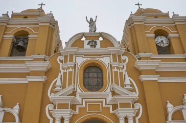 Bright yellow colonial style Cathedral in the Plaza de Armas of Trujillo, Peru