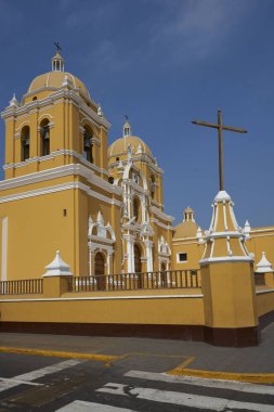 Bright yellow colonial style Cathedral in the Plaza de Armas of Trujillo, Peru