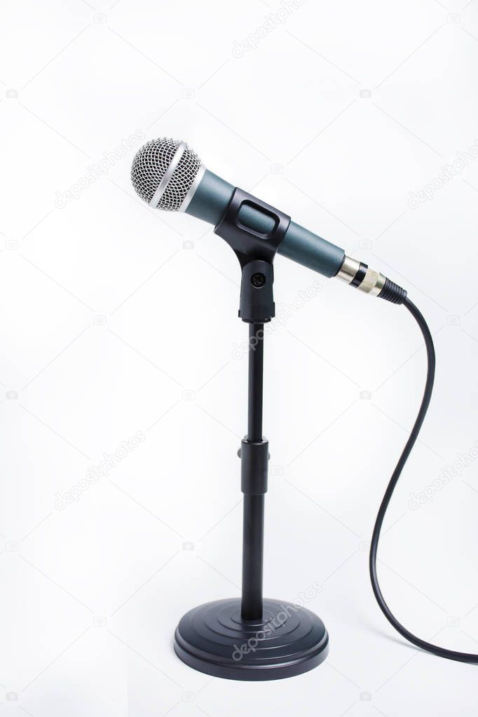 dynamic microphone on stand isolated on white background. Sound 
