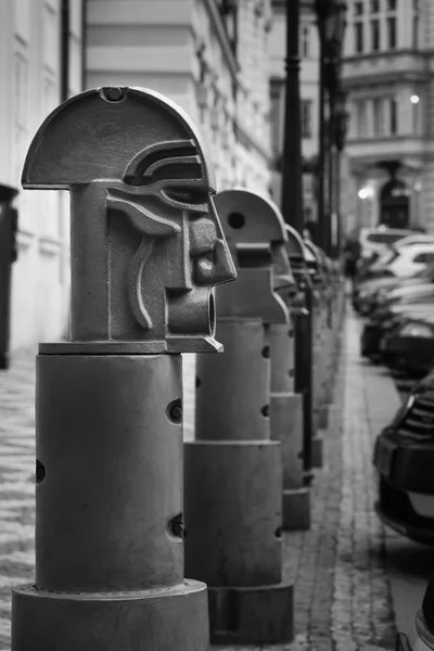 The fencing of pedestrian areas from cars in Prague looks like guards or knights