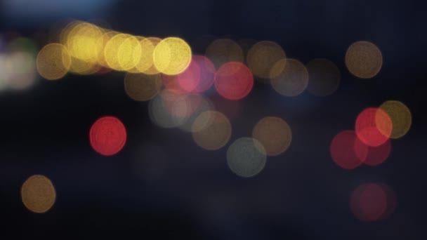 Defocused evening traffic lights - city street - abstract background - bokeh. Abstract Colorful Vivid Blurred Bright Lights Bokeh Background. — Stock Video