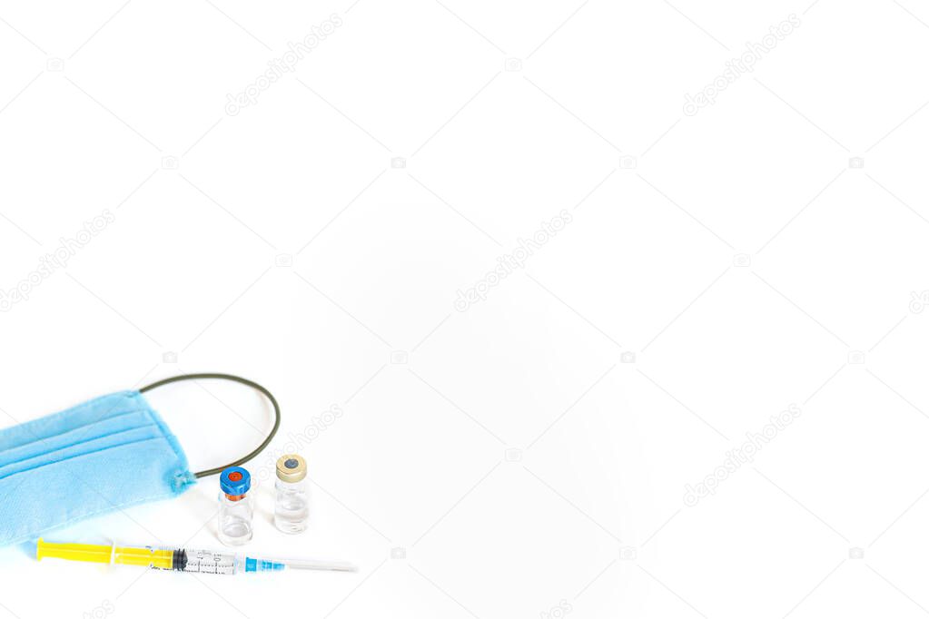 Syringe with vaccine and ampule and medical face mask