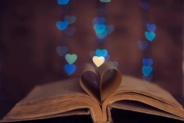 Book sheets heart and background bokeh heart