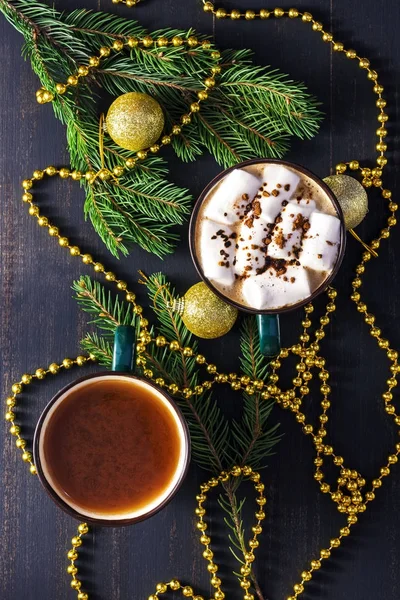 Christmas hot chocolate drink, top view. A cup of color is a shaded spruce.