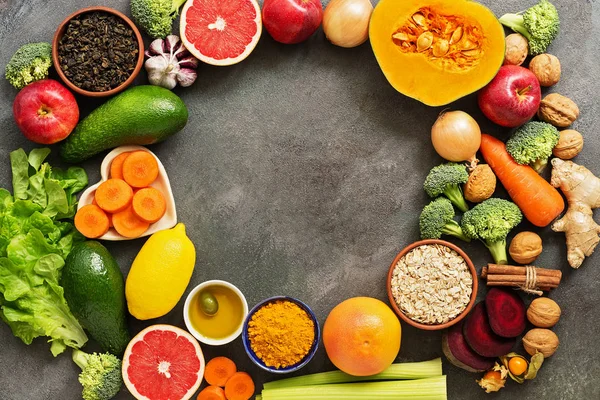 Liver detox diet food concept. Fruits,vegetables, nuts, olive oil, citrus fruits, green tea, turmeric, oats. Top view, flat lay,frame.
