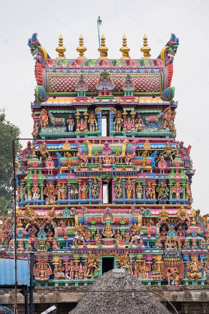 A Gopuram, or entrance tower, at the front of the 5th century Karpaga Vinayagar temple at Pillaiyarpatti in Tamil Nadu state, India. It was only during the last century that temple authorities began to paint the gateway carvings