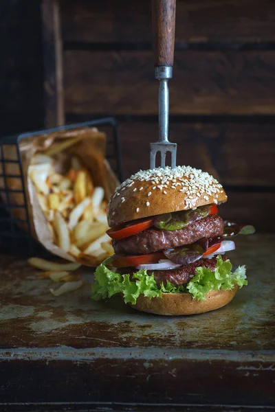 Delicious double burger with french fries