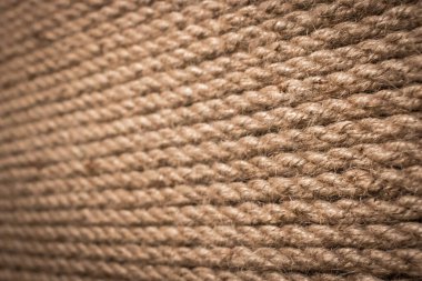 Kalın ip. İç dekorasyonda ip var. Doğal kenevir. Çatı katı tarzı element. Jüt arka plan. Kabataslak iplik yakın plan. Sarmalanmış ip. Kedi pençesinin ucu için tuval.