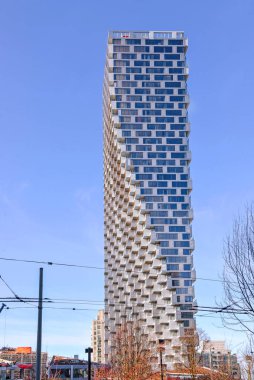 Vancouver, Canada - March 4, 2020:  Vancouver House on Howe Street is a neo-futurist mixed used residential skyscraper designed by Bjarke Ingels.