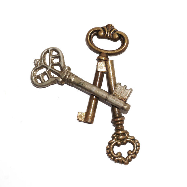 Три ключа от золотого ретро-скелета, изолированные поверх белого
     