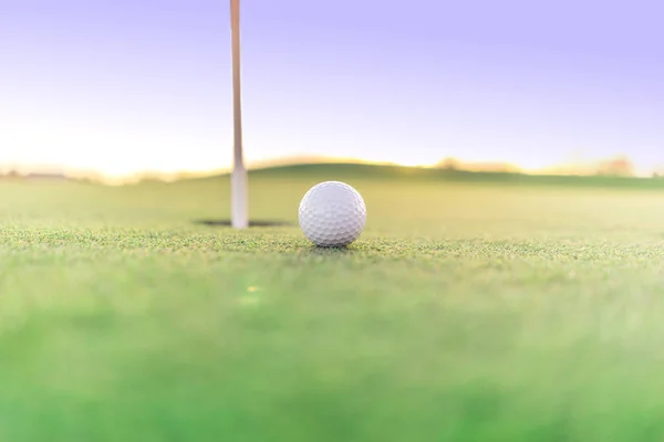 Golf ball close to hole — Stock Photo, Image
