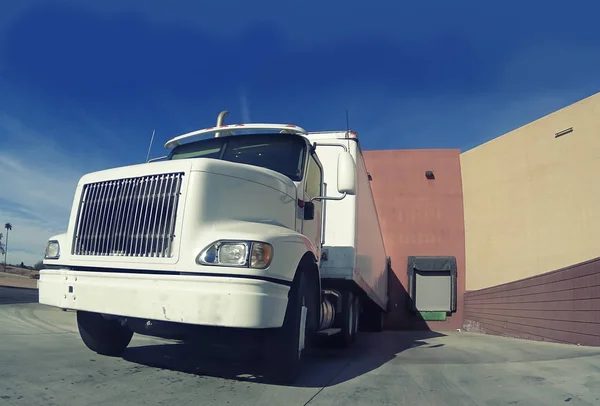 Heavy goods truck at warehouse loading doc — Stock Photo, Image